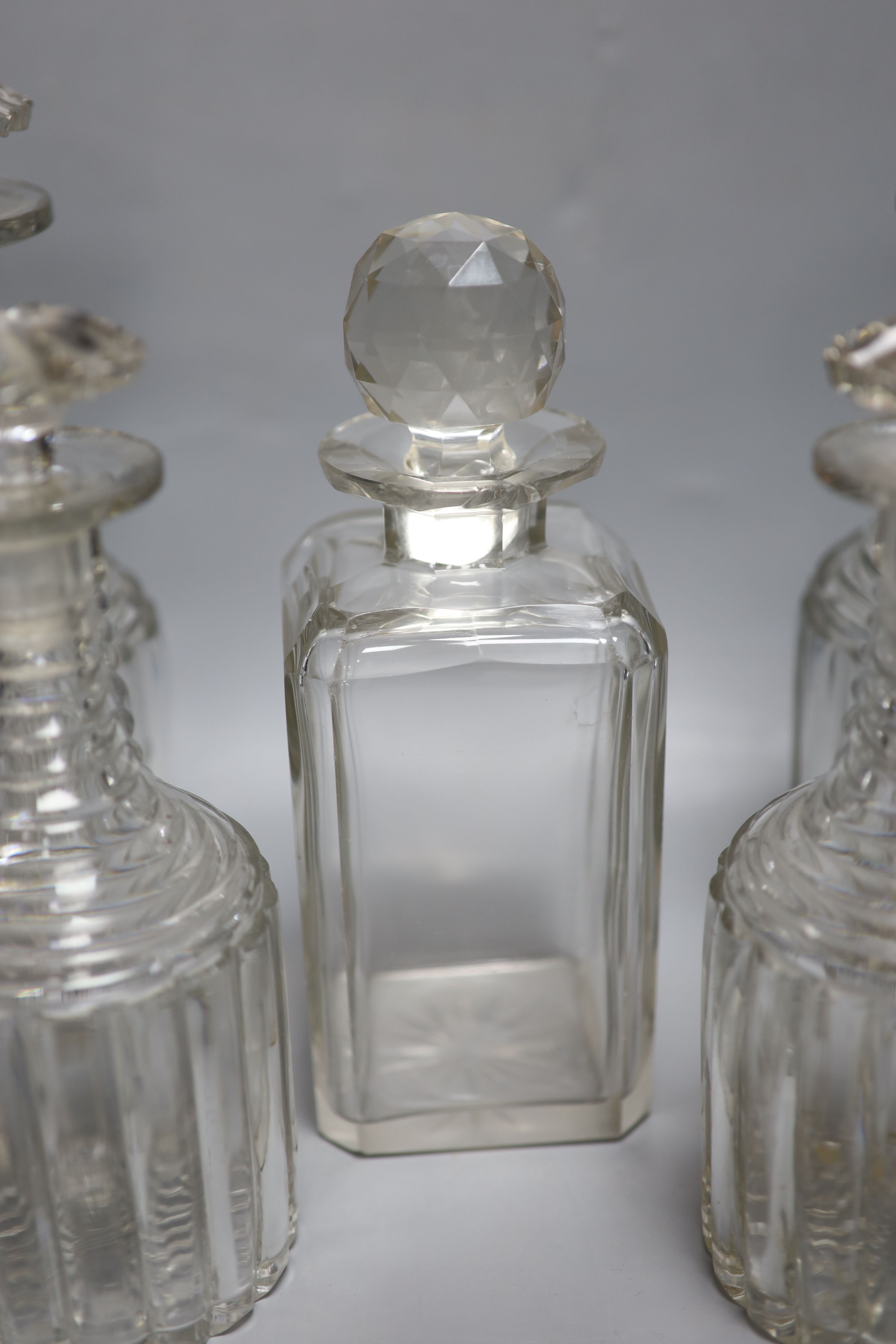 A set of four glass decanters, a matching pair and another, 25cm